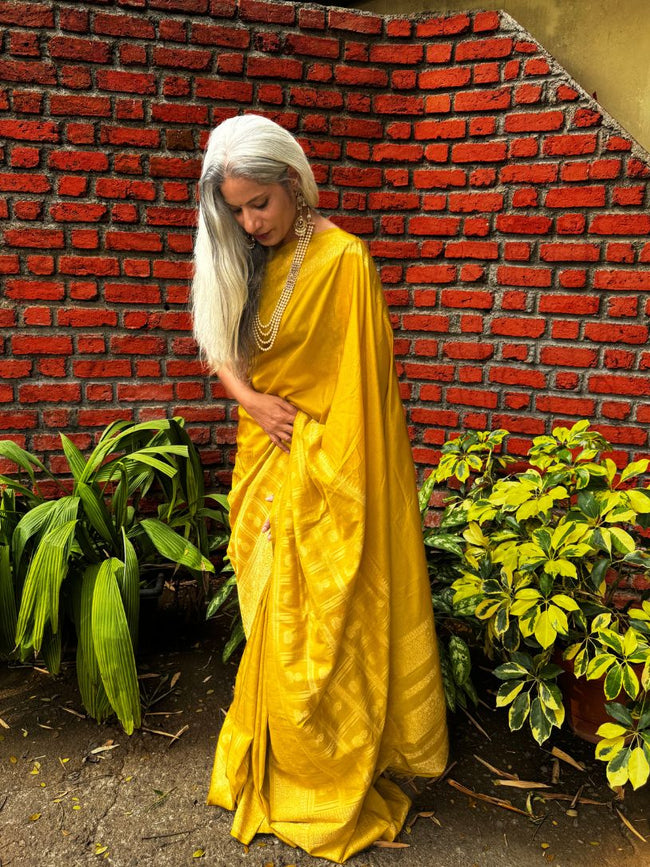Yellow silk saree with zari border Hover Image